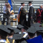 Shaking hands with President Jack Ohle